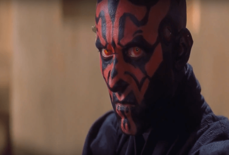 Death Maul turns his head and stares to the side.