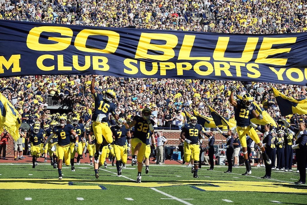 Denard Robinson #16 of the University of Michigan Wolverines leads his team to the field before a Big Ten College football game against the Univerity of Massachusetts Minutemen at Michigan Stadium on September 15, 2012 in Ann Arbor, Michigan. (Photo by Dave Reginek/Getty Images)