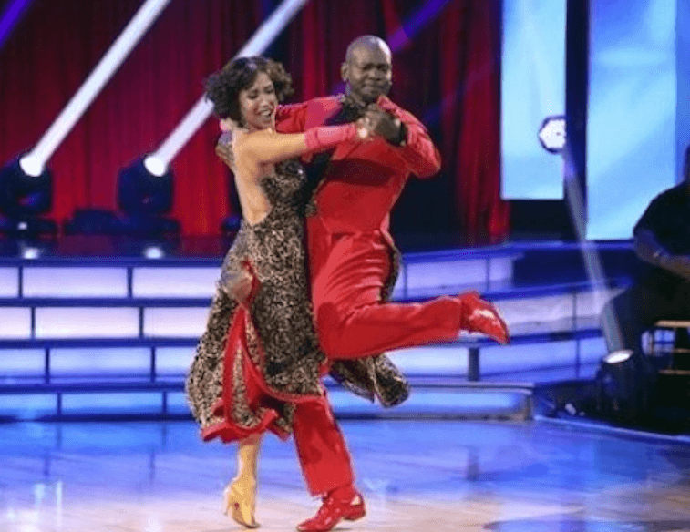 Emmitt Smith dancing with his partner on the dance floor. Emmitt Smith dancing with his partner on the dance floor.