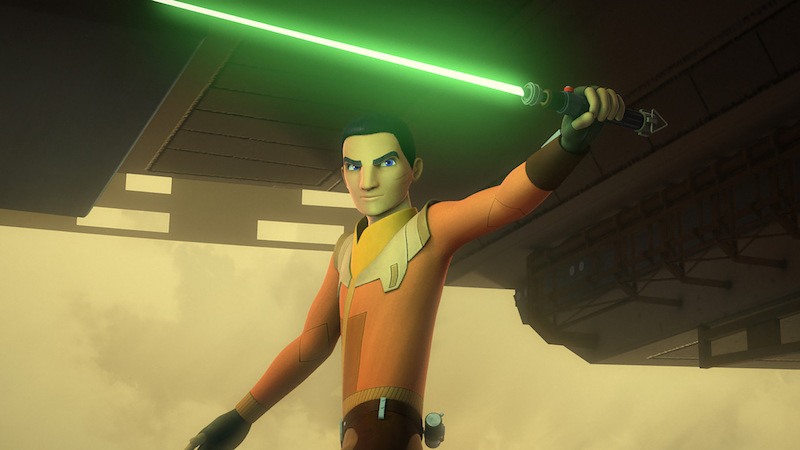 Ezfra Bridger holds up a light saber in 'Star Wars Rebel'