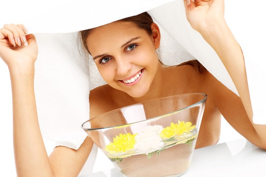 woman doing facial treatment in spa