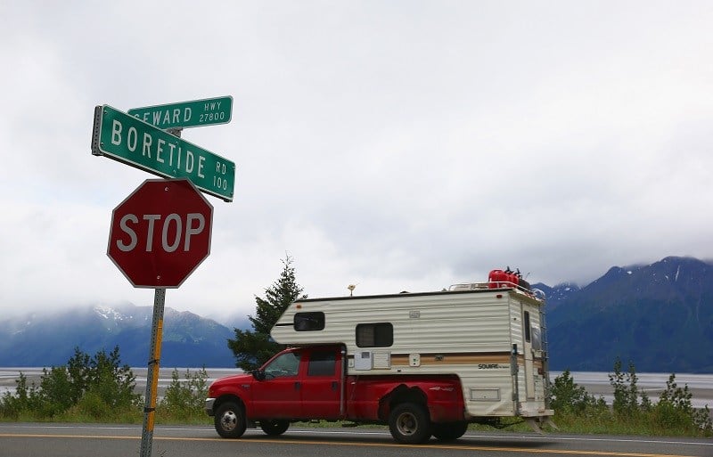 ANCHORAGE, AK - JULY 11: A truck passes a street sign named for the Bore Tide at Turnagain Arm on July 11, 2014 in Anchorage, Alaska. Alaska's most famous Bore Tide, occurs in a spot on the outside of Anchorage in the lower arm of the Cook Inlet, Turnagain Arm, where wave heights can reach 6-10 feet tall, move at 10-15 mph and the water temperature stays around 40 degrees Fahrenheit. This years Supermoon substantially increased the size of the normal wave and made it a destination for surfers. 