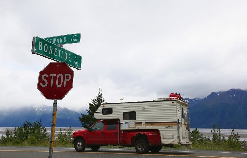 ANCHORAGE, AK - JULY 11: A truck passes a street sign named for the Bore Tide at Turnagain Arm on July 11, 2014 in Anchorage, Alaska. Alaska's most famous Bore Tide, occurs in a spot on the outside of Anchorage in the lower arm of the Cook Inlet, Turnagain Arm, where wave heights can reach 6-10 feet tall, move at 10-15 mph and the water temperature stays around 40 degrees Fahrenheit. This years Supermoon substantially increased the size of the normal wave and made it a destination for surfers.