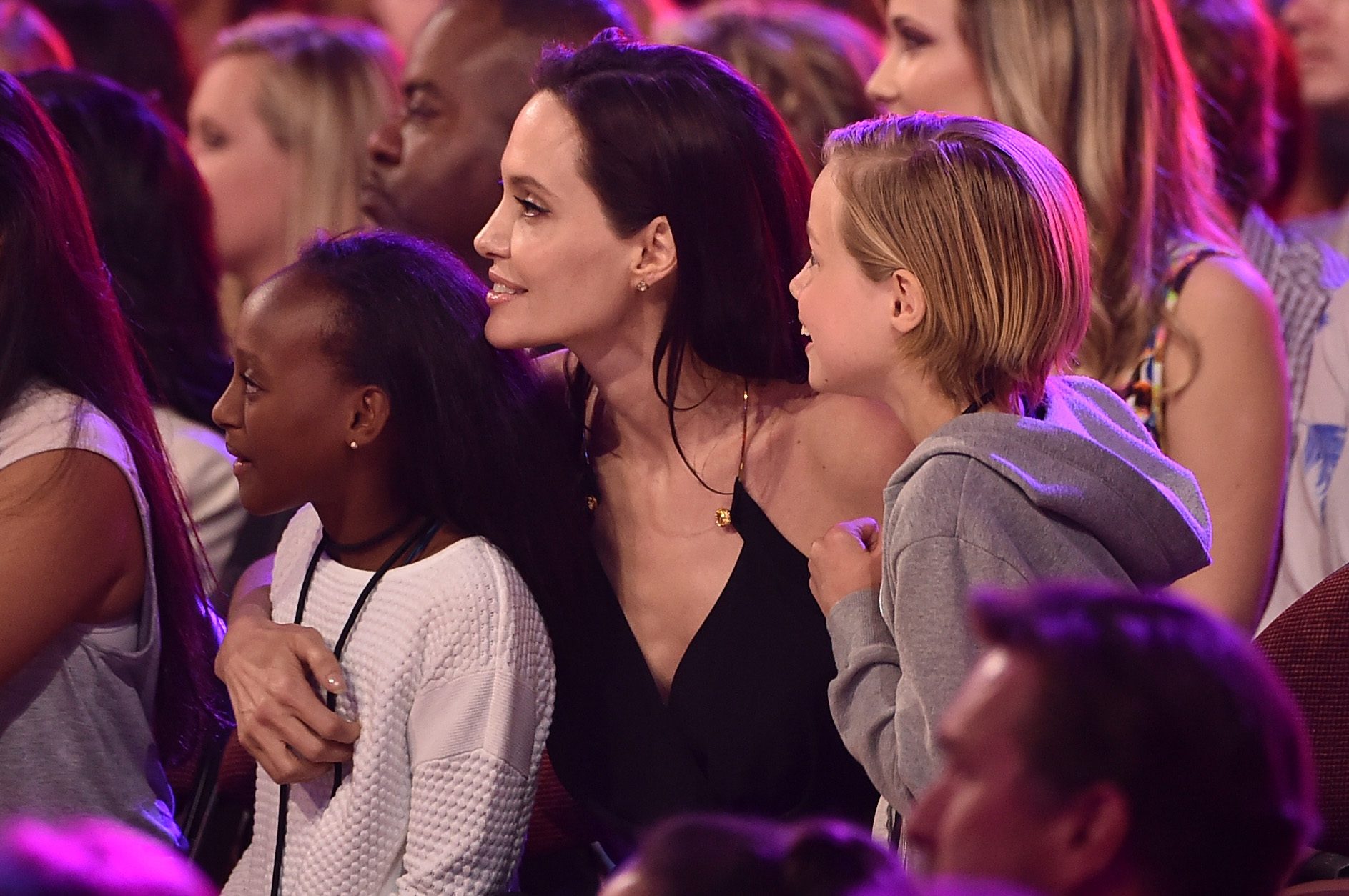 actress Angelina Jolie hugs Zahara Marley Jolie-Pitt and Shiloh Nouvel Jolie-Pitt
