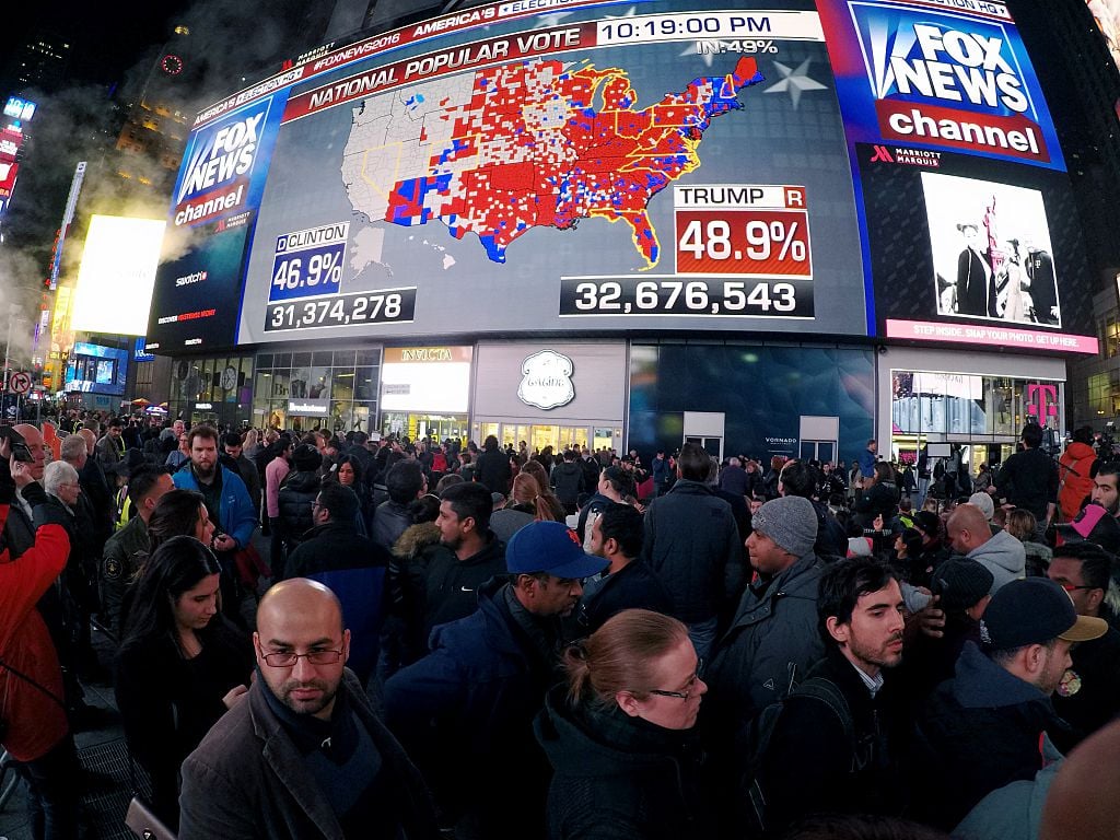 Times Square filled with people at night as the results of the 2016 presidential election are shown on screen Times Square filled with people at night as the results of the 2016 presidential election are shown on screen