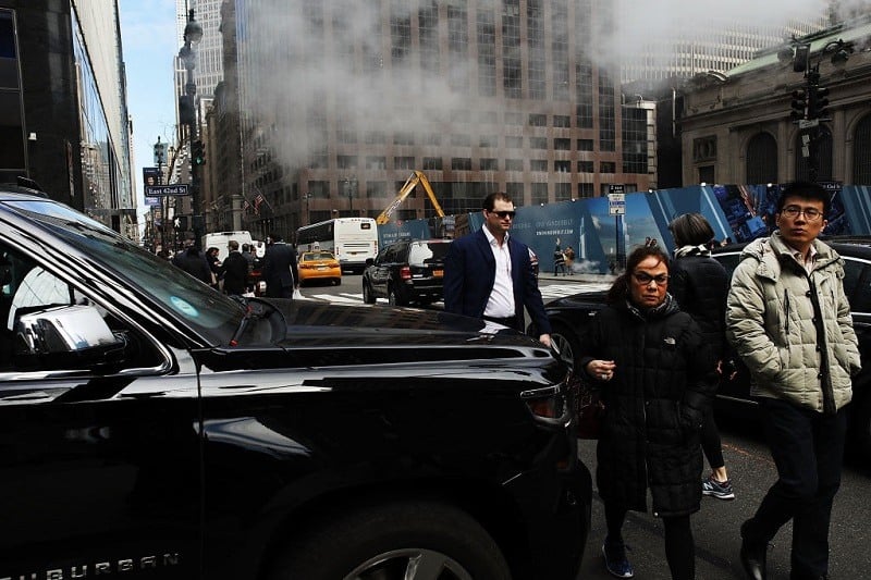 Chevy Suburban stops in the middle of an intersection while pedestrians try to cross on March 30, 2017 in New York City.