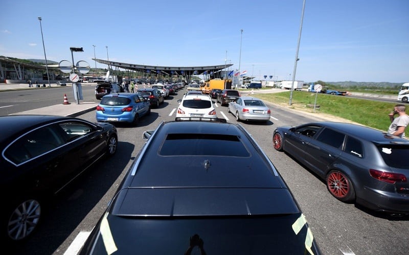 Cars queue in line at the Croatian border with Slovenia in Bregana, near Zagreb on April 14, 2017 as new checks aimed at stopping suspected Islamist fighters from Iraq and Syria, produced traffic chaos on the border, a key bottleneck on the so-called Balkan migrant trail shut down last year.