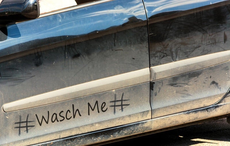 View of a dirty car below the driver's side windows