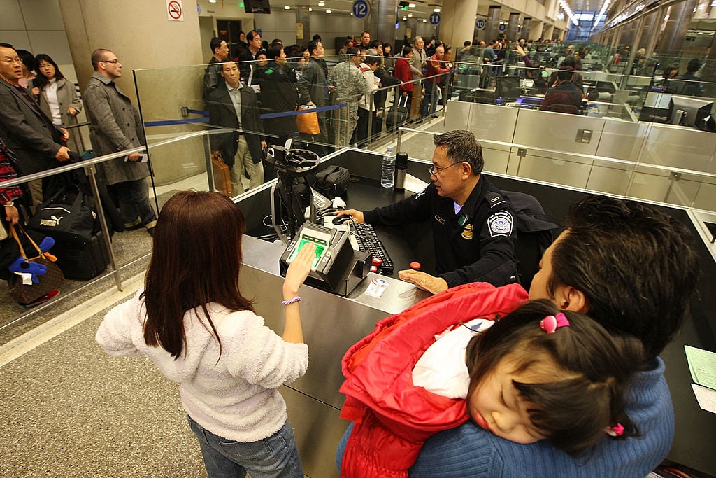 Travelers speak with CPB at an airport