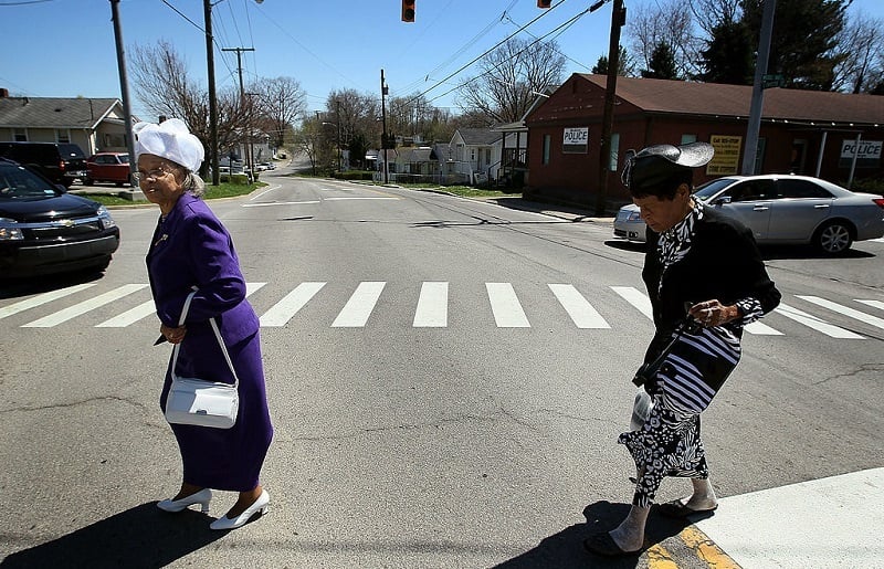 BECKLEY, WV - APRIL 11: Dorothy Payne (R) and Minnie Shepard walk across the street to attend a funeral service for coal miner William Roosevelt Lynch, on April 11, 2010 in Beckley, West Virginia. Mr. Lynch was killed on April 5, along with 28 other coal miners when a methane-gas explosion occurred at the Massey Energy Company's Upper Big Branch Coal Mine. 