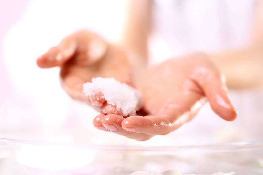 woman imposes on hand scrub cosmetic