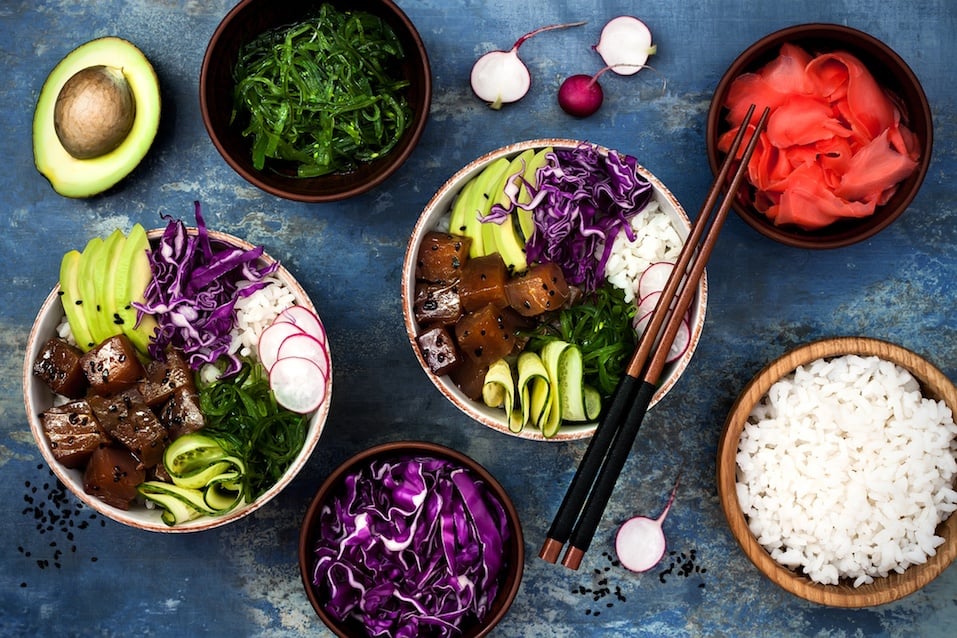Hawaiian tuna poke bowl with seaweed, avocado, red cabbage, radishes and black sesame seeds