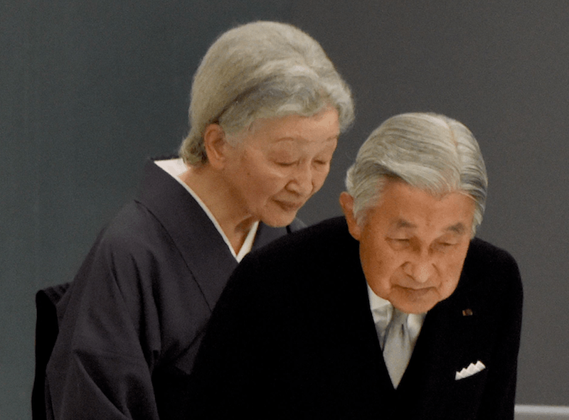 Japan's Emperor Akihito and Empress Michiko bow to their guests during a ceremony. Japan's Emperor Akihito and Empress Michiko bow to their guests during a ceremony.