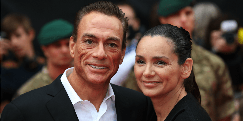Jean-Claude Van Damme and Gladys Portugues pose together on the red carpet.