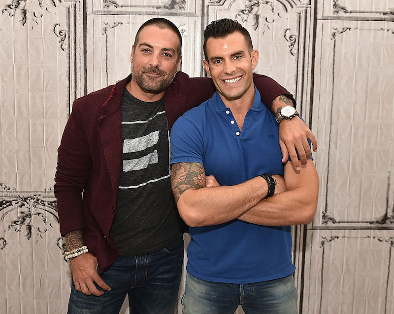 Anthony Carrino and John Colaneri posing in front of a decorative wall. Anthony Carrino and John Colaneri posing in front of a decorative wall.