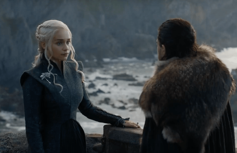 Daenerys Targaryen looks at Jon Snow while standing outside Daenerys Targaryen looks at Jon Snow while standing outside