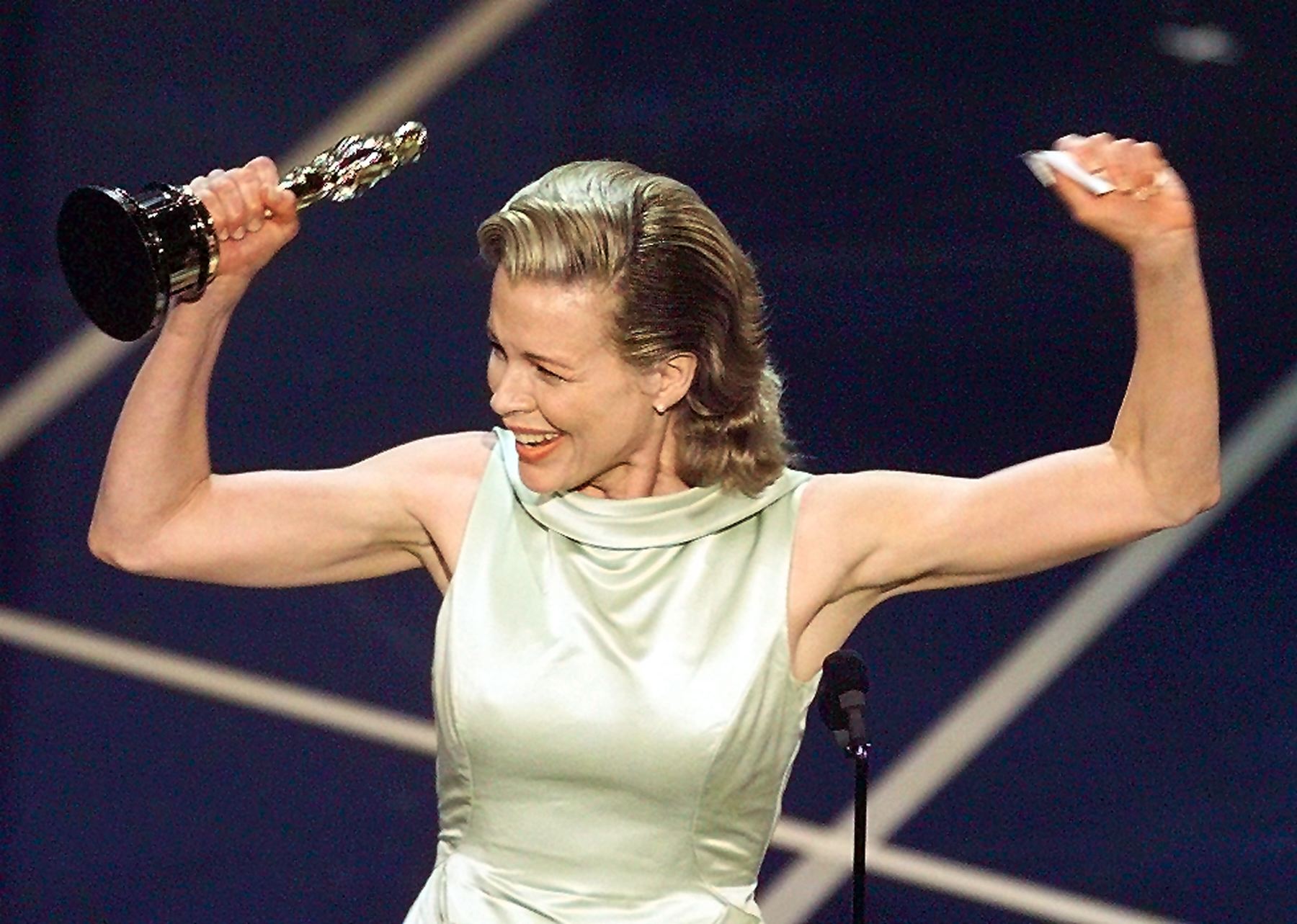 Actress Kim Basinger holds up her Oscar after winning the Best Supporting Actress Oscar for her role in "L.A. Confidential" during the 70th Academy Awards at the Shrine Auditorium 23 March. Actress Kim Basinger holds up her Oscar after winning the Best Supporting Actress Oscar for her role in "L.A. Confidential" during the 70th Academy Awards at the Shrine Auditorium 23 March.