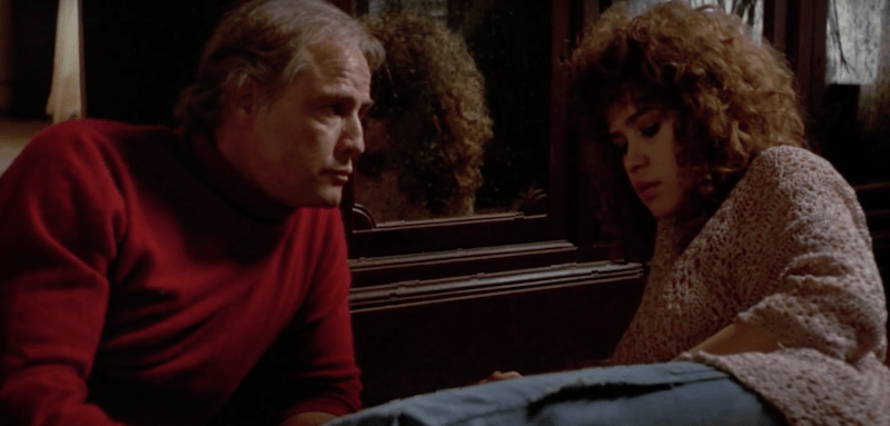 A man and woman sit in front of a mirror A man and woman sit in front of a mirror
