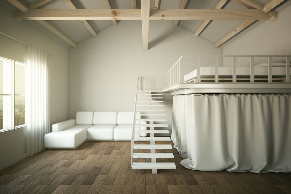 Living room with sofa and elevated bedroom section
