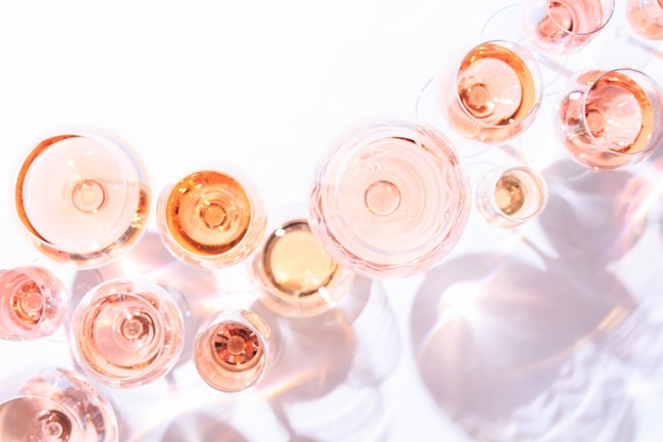 Many glasses of rose wine at wine tasting