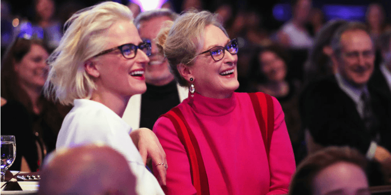 Meryl Streep and Mamie Gummer sit next to each other smiling and wearing the same kind of glasses. Meryl Streep and Mamie Gummer sit next to each other smiling and wearing the same kind of glasses.