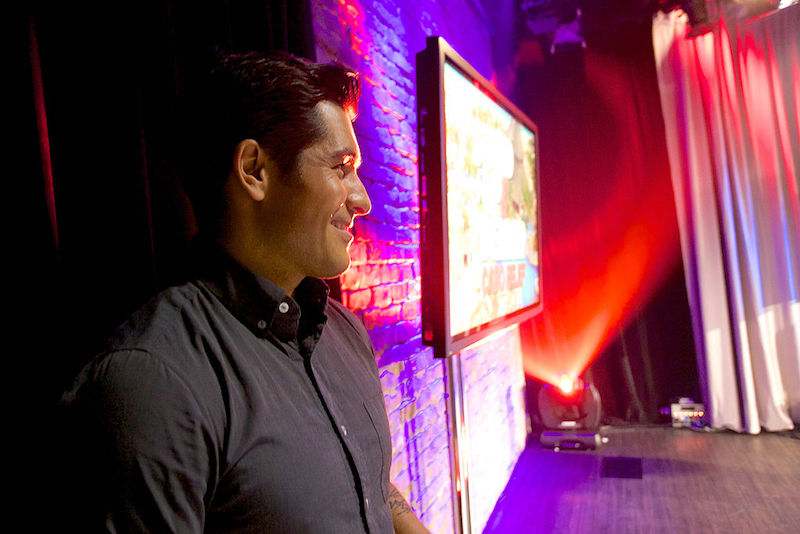 Mike Catherwood stands on stage during a charity event. Mike Catherwood stands on stage during a charity event.