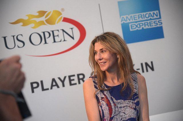 Monica Seles poses for photos and looks over her shoulder. Monica Seles poses for photos and looks over her shoulder.