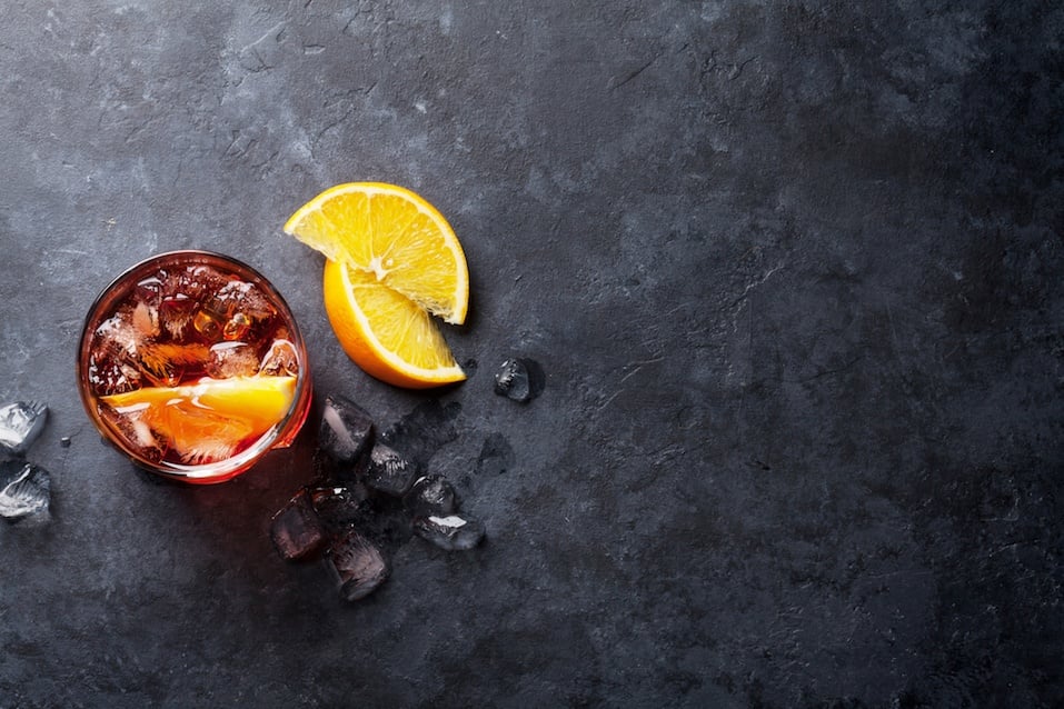 Negroni cocktail on dark stone table