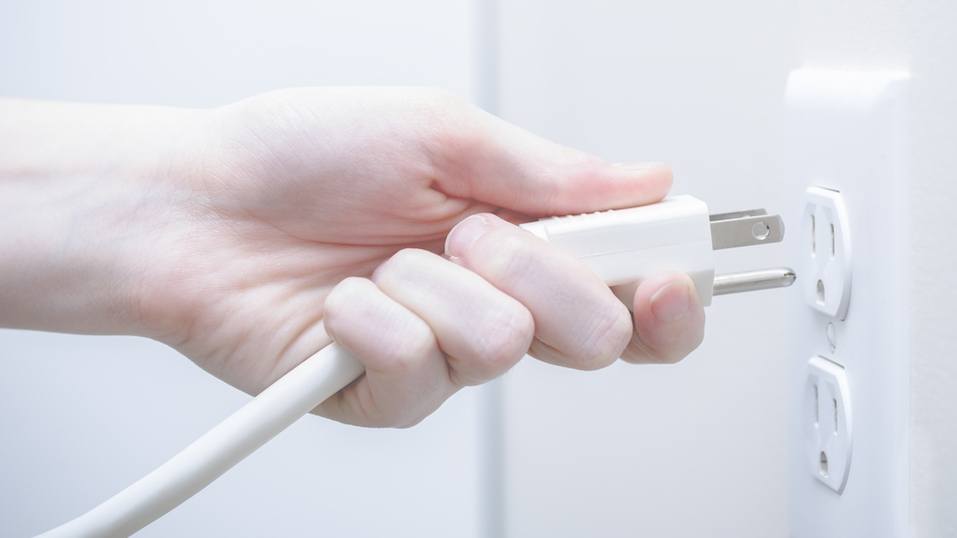 Plugging in a power cord