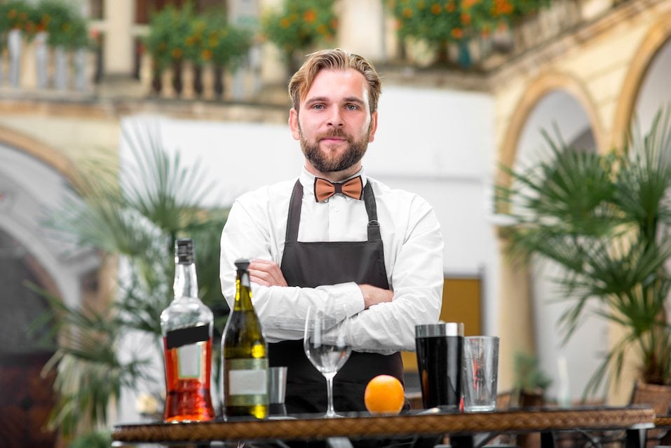 Portrait of handsome barman in uniform