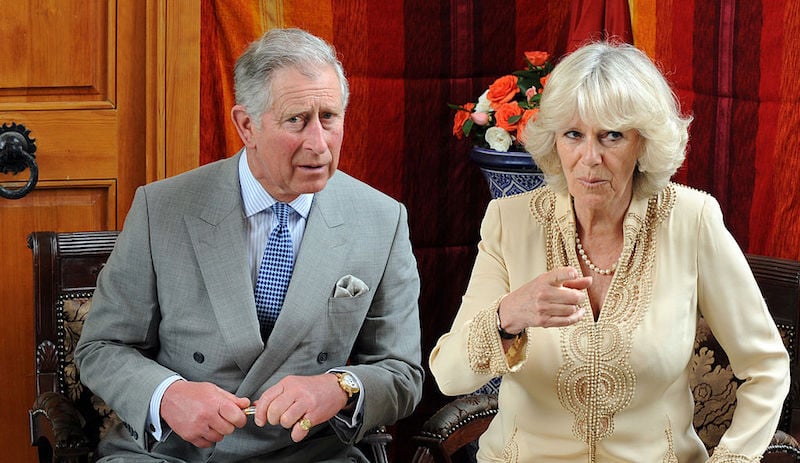 Prince Charles sits next to Camilla Parker Bowles. 
