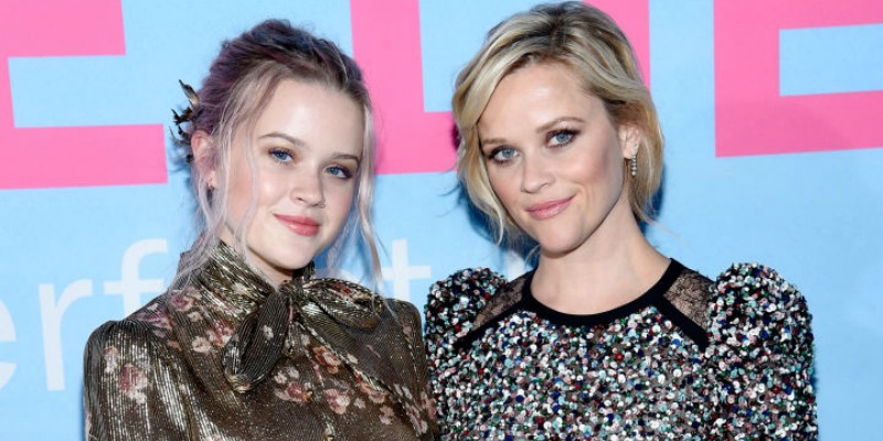 Reese Witherspoon and Ava Elizabeth Phillippe pose together in dresses on the red carpet.