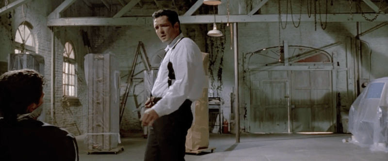 A man stands in an torture chamber in Reservoir Dogs