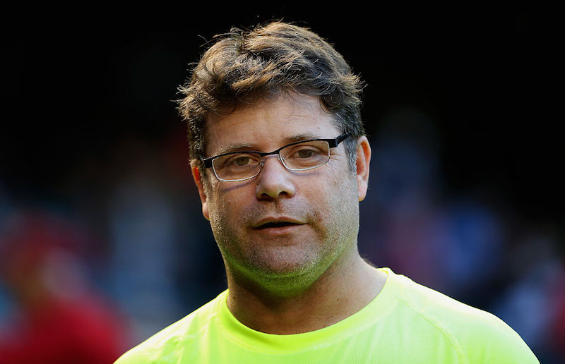 Sean Astin stands at a Dodger's game.