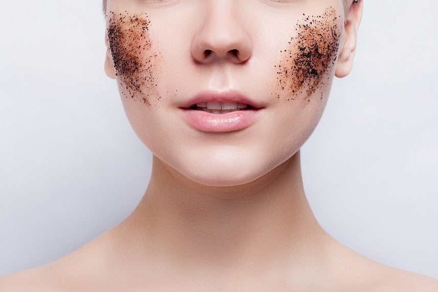 Woman cleans the skin coffee skrub