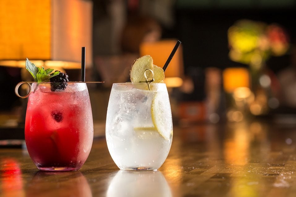 Two glasses of frozen lemonade on bar