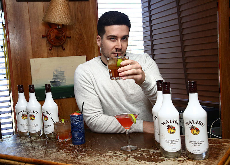 Vinny Guadagnino poses with bottles of Malibu.
