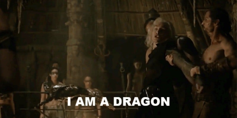 Viserys is being pulled along with two men as he yells "I am a dragon."