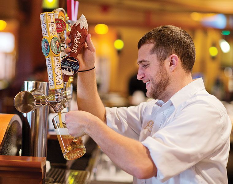 bartender pouring beer at Wegmans
