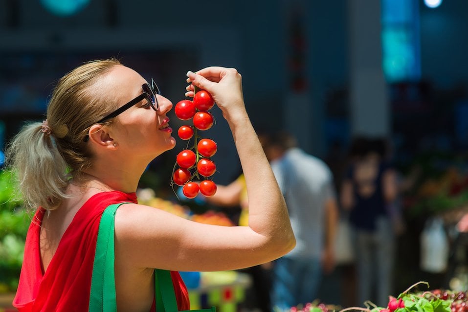 Woman buys tomatoes