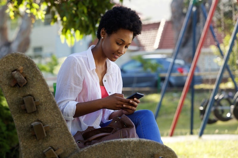 Woman texting on her phone Woman texting on her phone