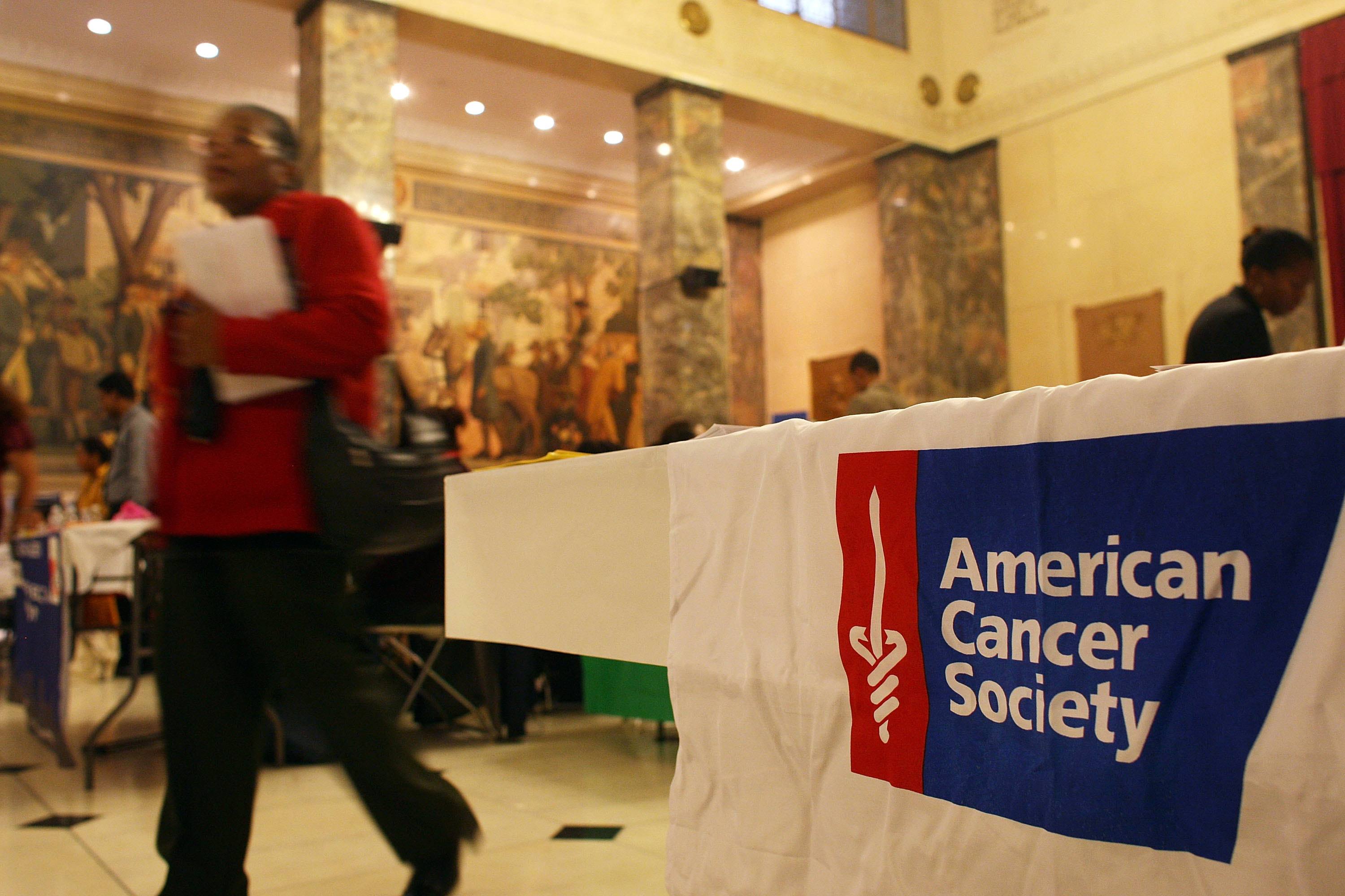 An American Cancer Society logo hanging off of a table An American Cancer Society logo hanging off of a table