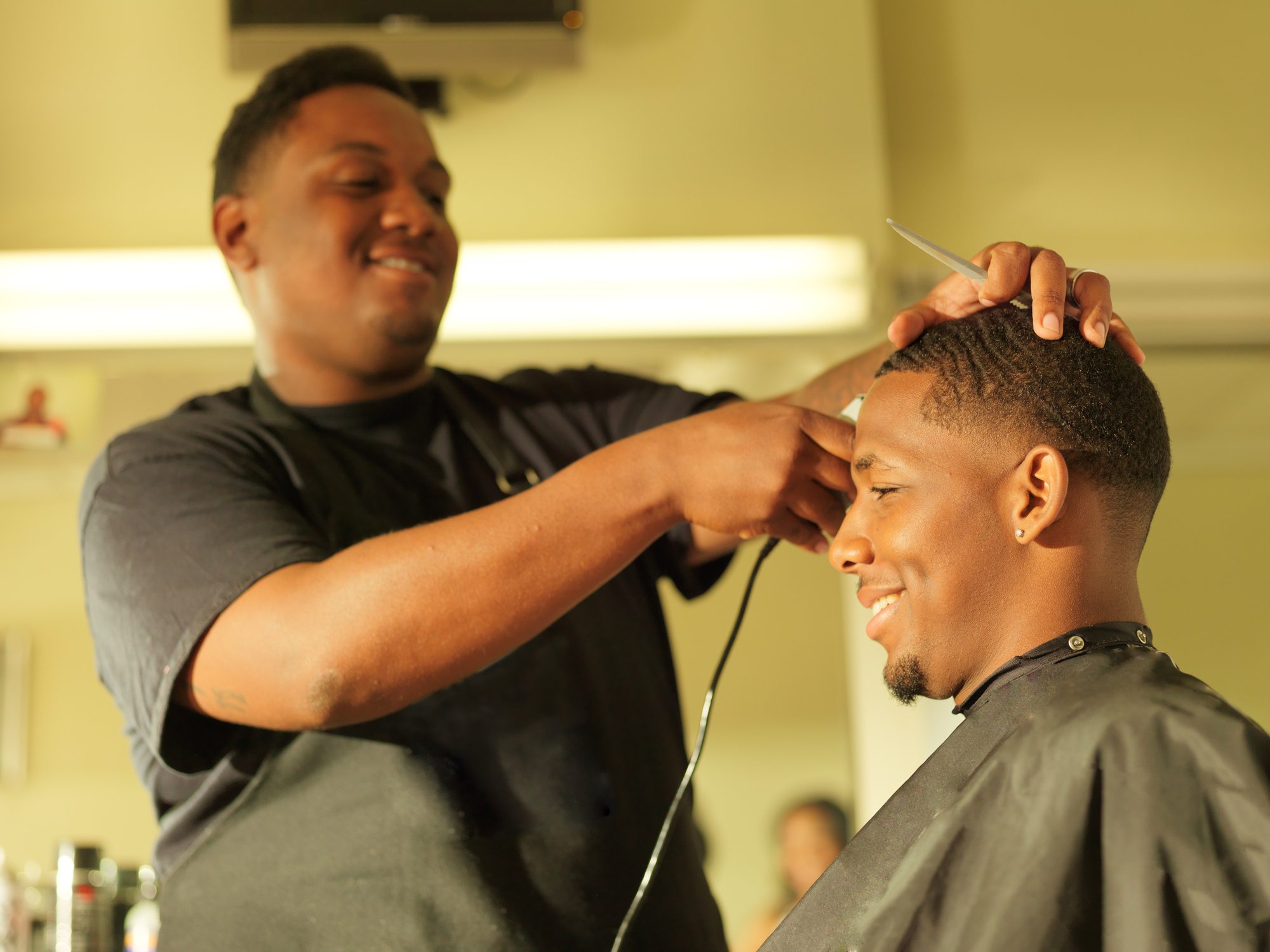 Male barber cutting hair