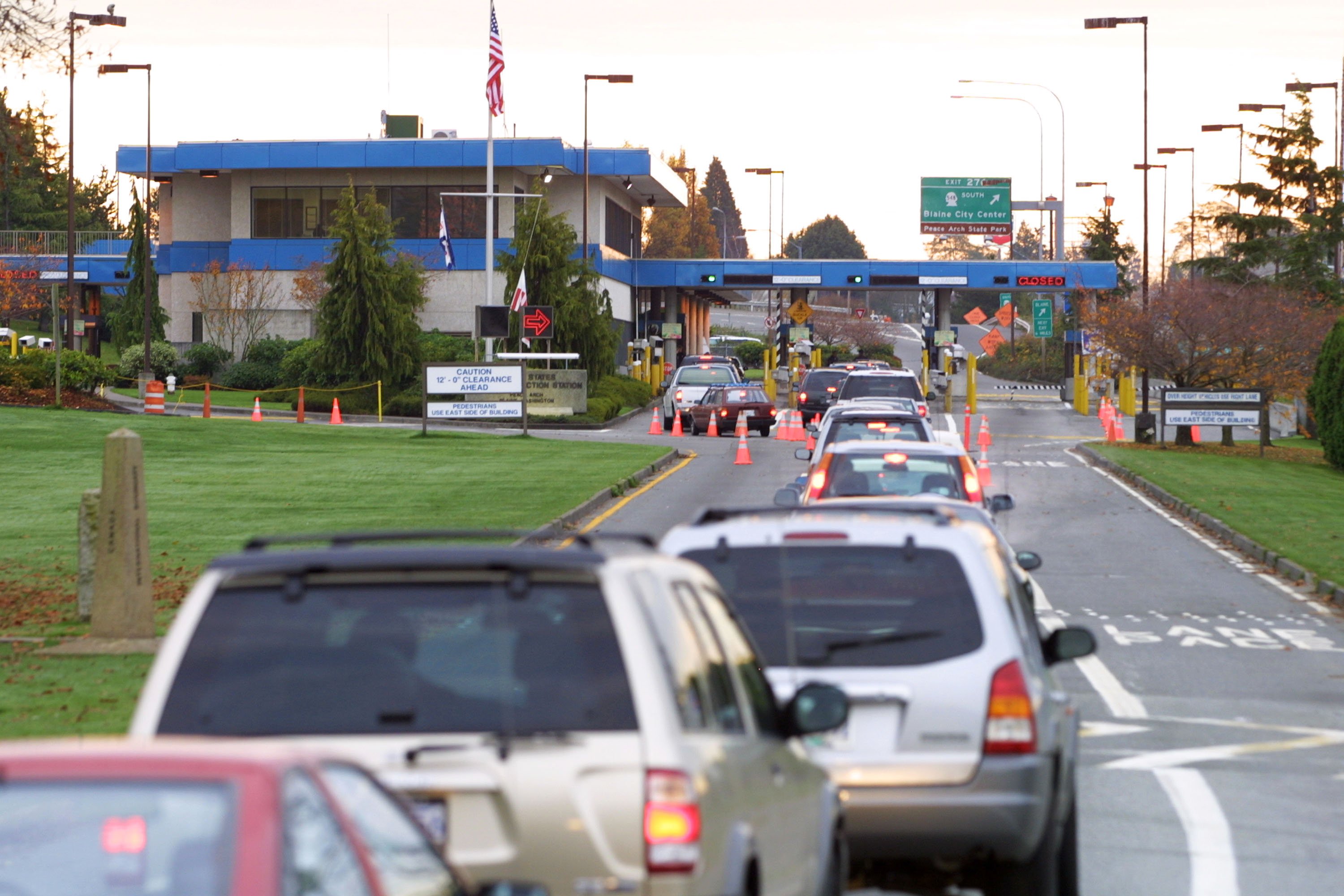 Vehicles line up to enter the United States at the border crossing between Blaine, Washington and White Rock, British Columbia