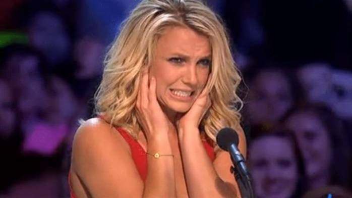 Britney Spears covering her ears