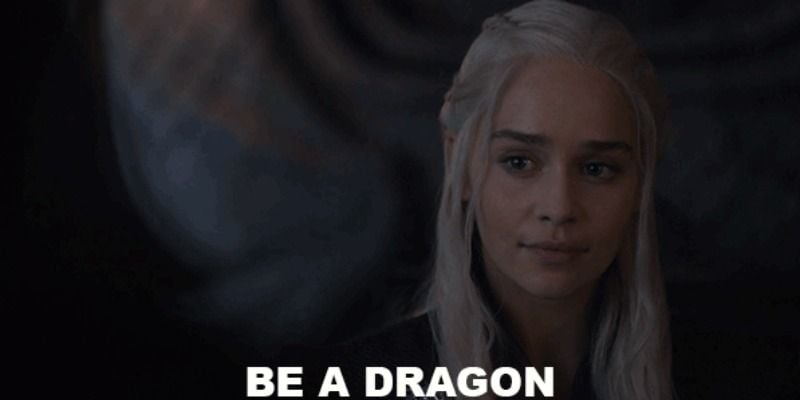 Daenerys Targayen is smiling with the words "be a dragon" below her face.