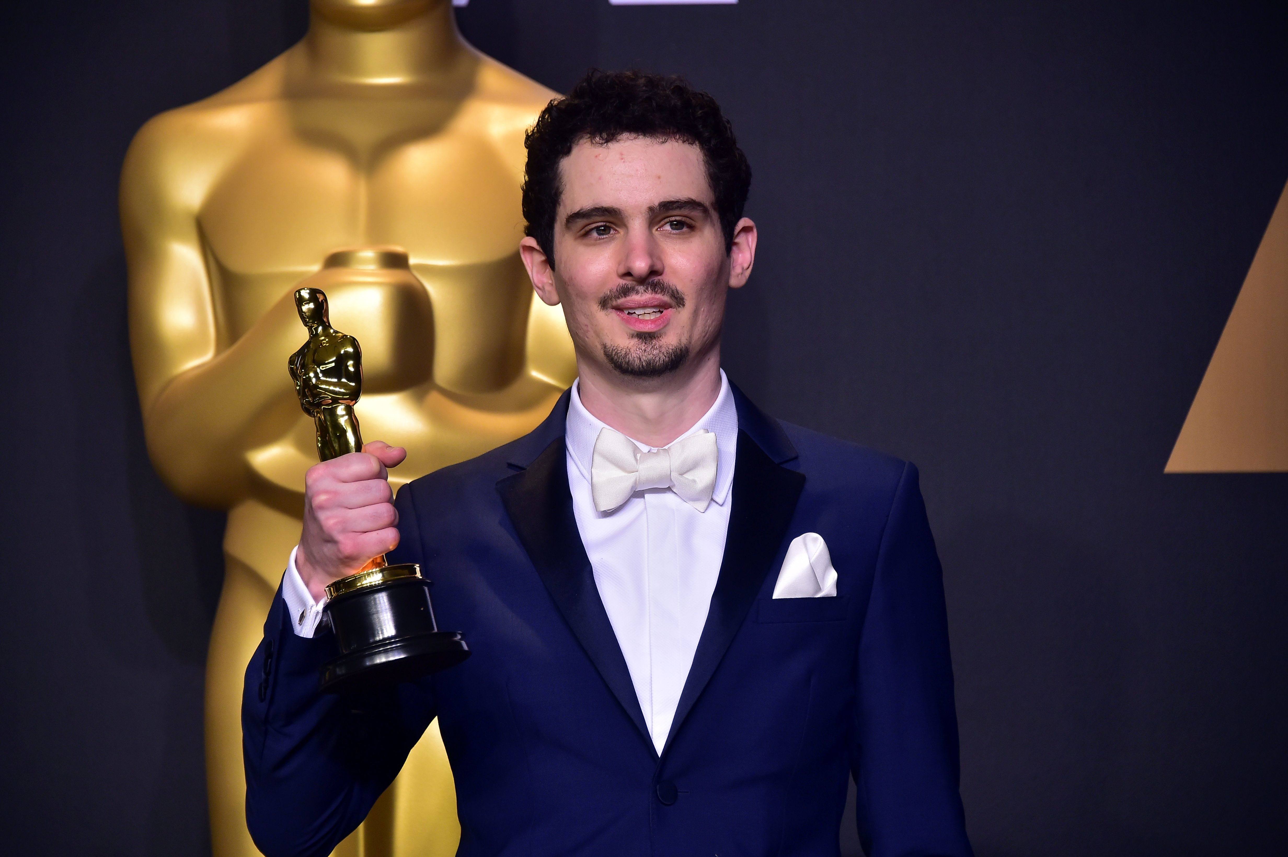 Director Damien Chazelle with his Oscar