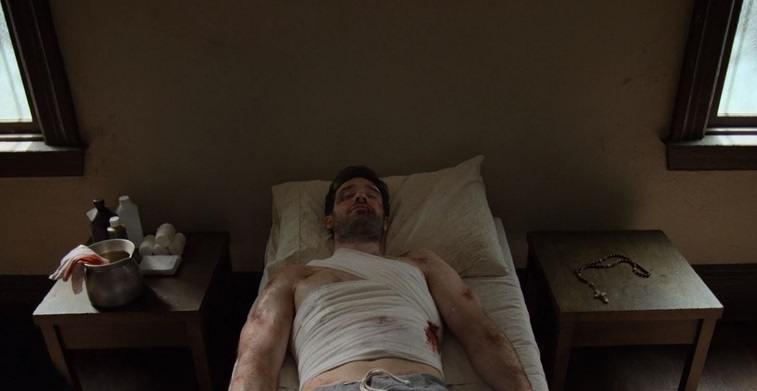 Matt lays in bed injured
