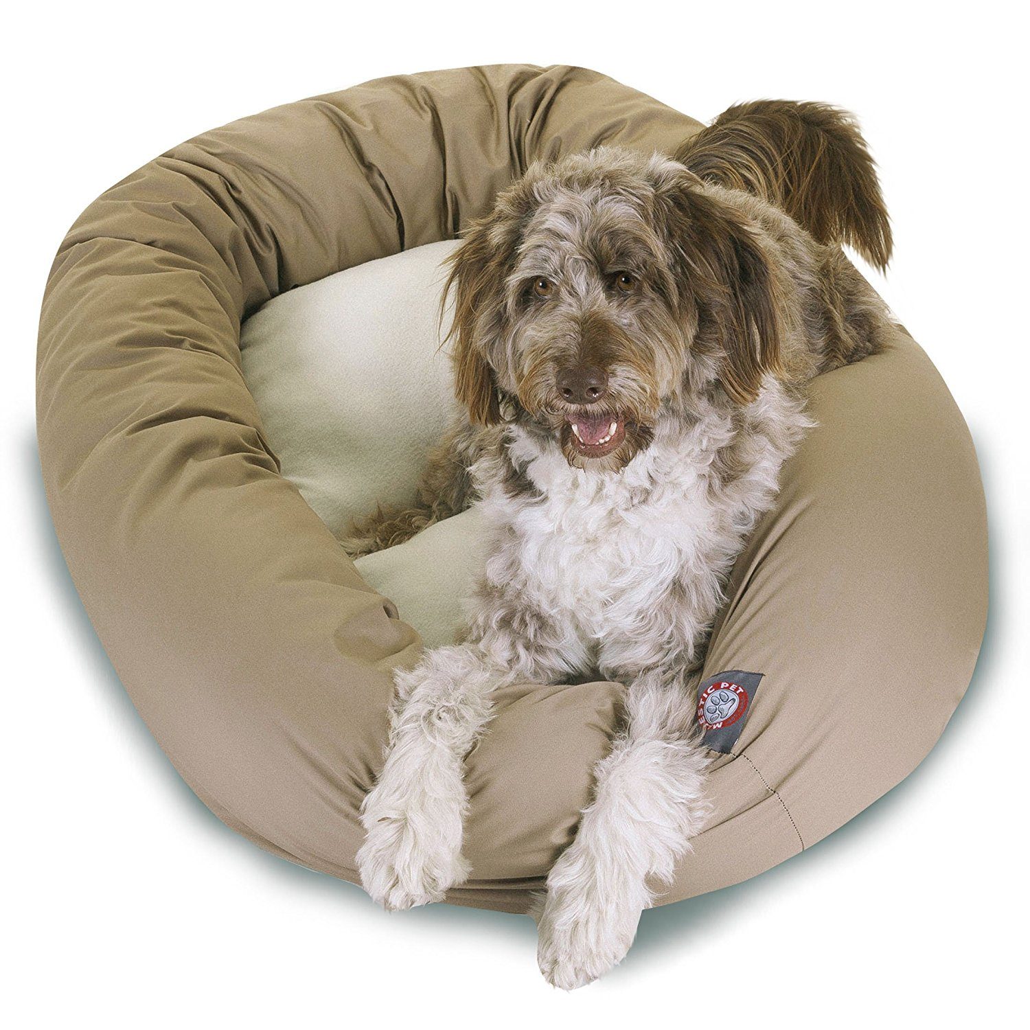 Tan dog bed with dog