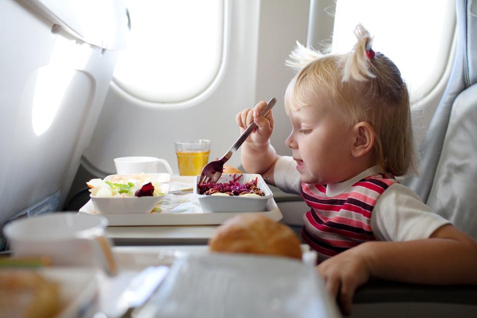 child eating in the airplane